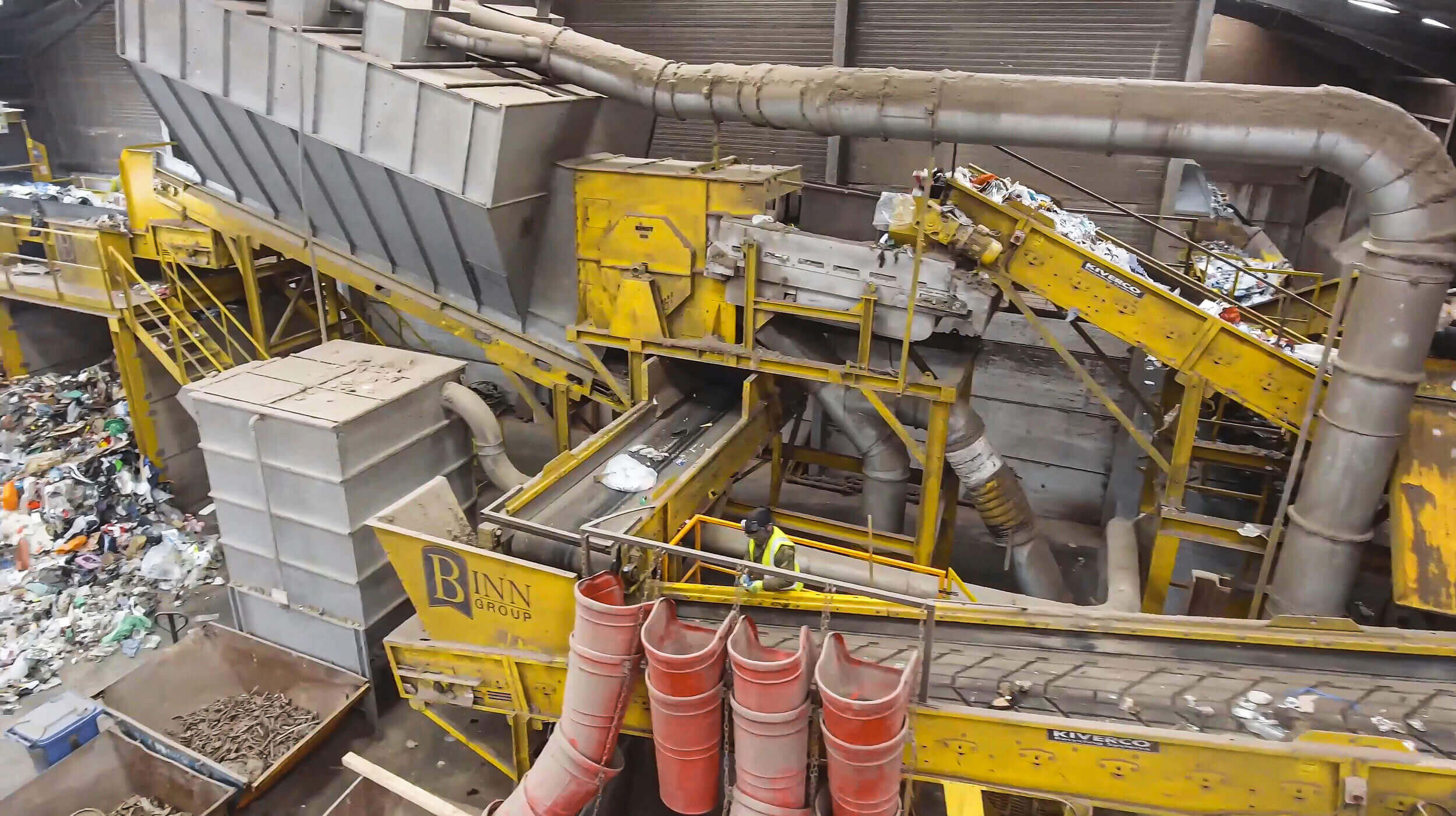 The conveyor belt system transports materials that were screened by the wind sifter to the picking station.
