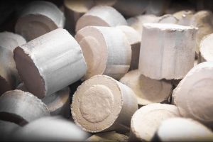 Briquetted MDF dust in briquette form