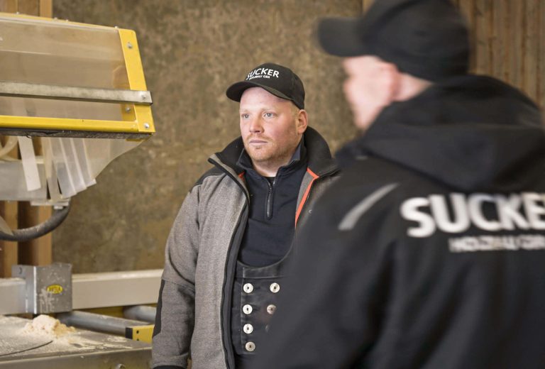 Malte Sucker, managing director and master carpenter, stands in front of another employee