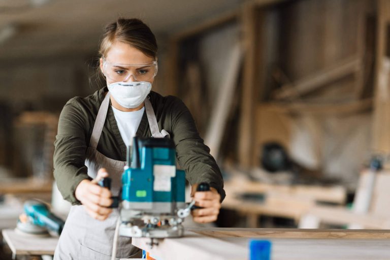 Carpenter working with woodworking machines