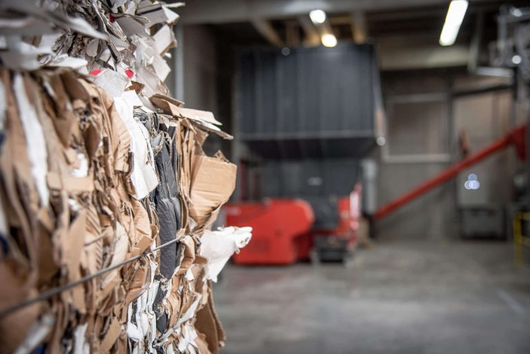 close up of shredded cardboard bales in a warehouse