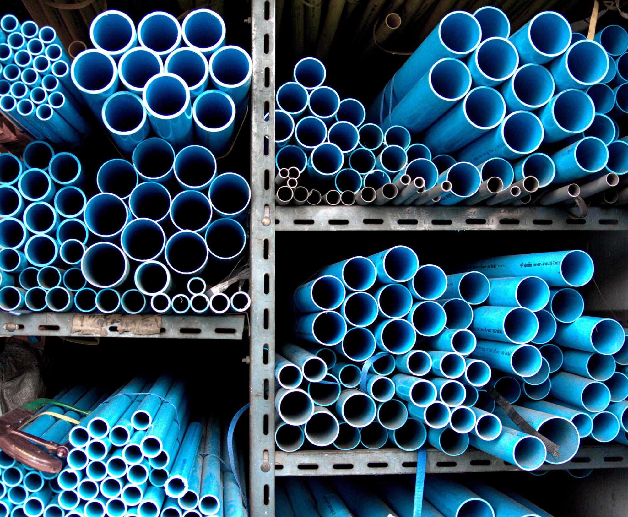 Old pipes with small diameters are stored stacked