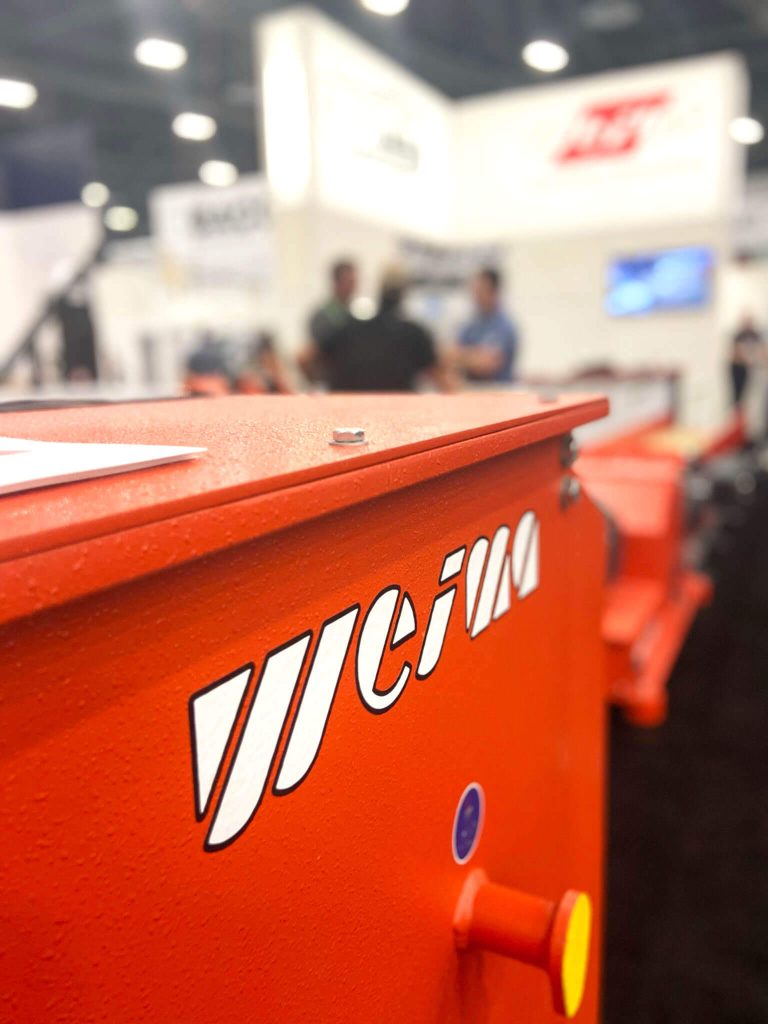 A shredder is shown within the WEIMA booth at AWFS Fair 2021.