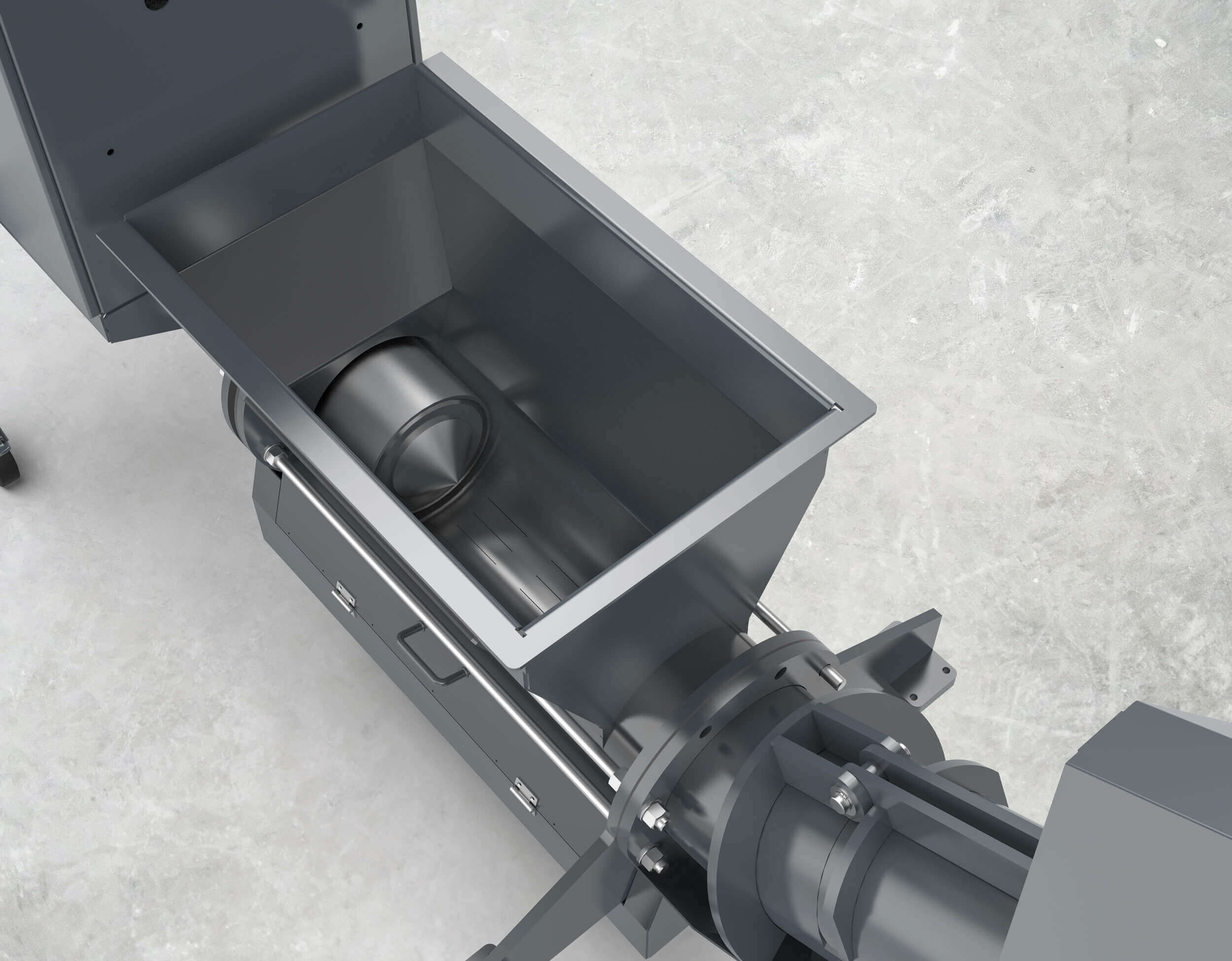 View into the hopper. This shows the press plunger in the press channel and the absence of a screw conveyor.