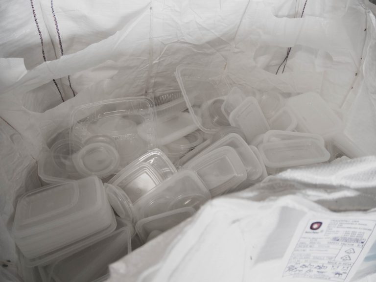 A gaylord of used take-away containers awaits shredding.