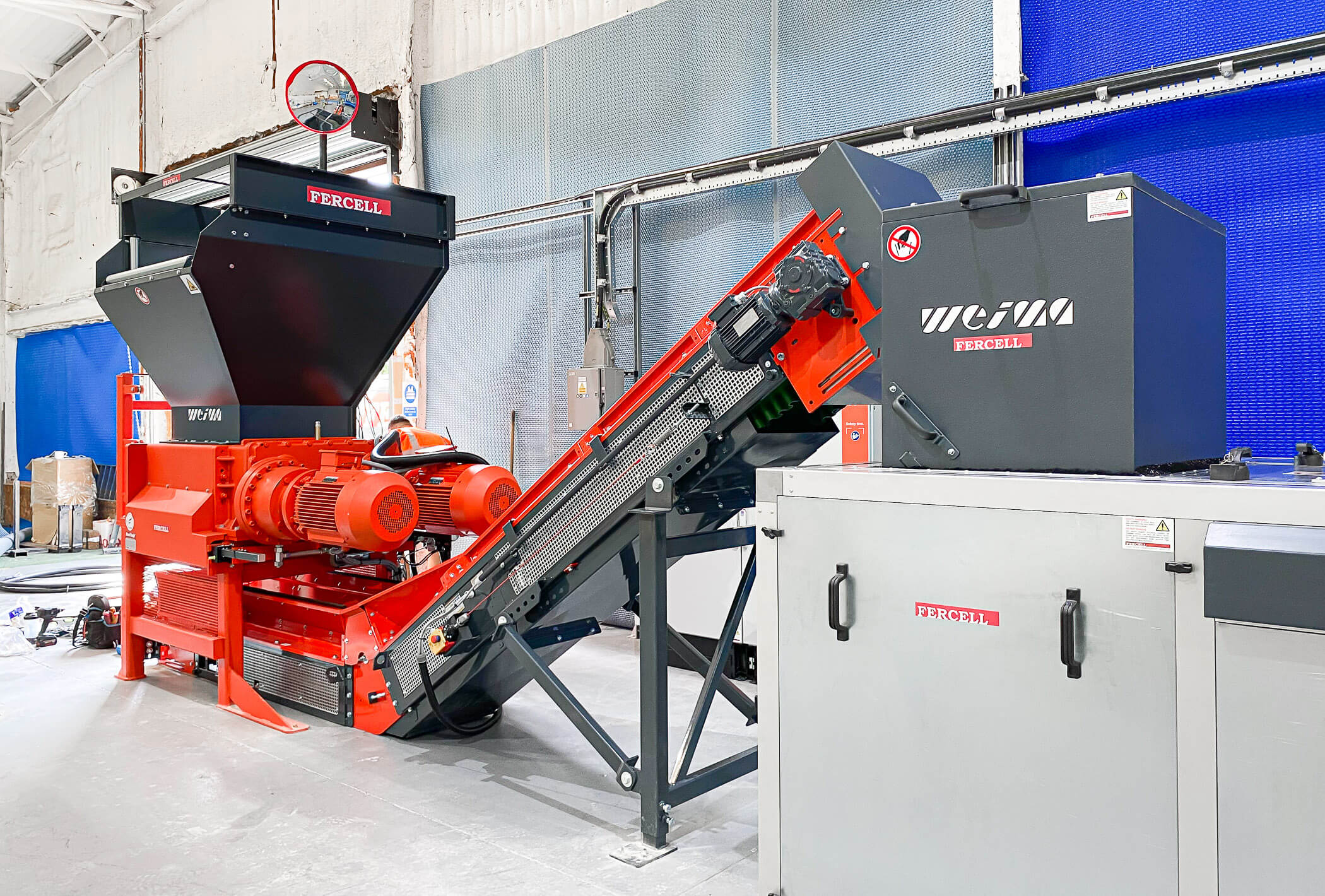 two weima shredders in orange for pool cover recycling
