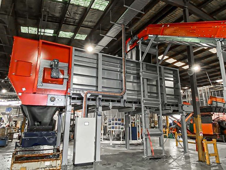rectangular bunker for shredded plastic in a production hall