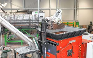 orange weima shredder fed by forklift at stiphout plastic production site