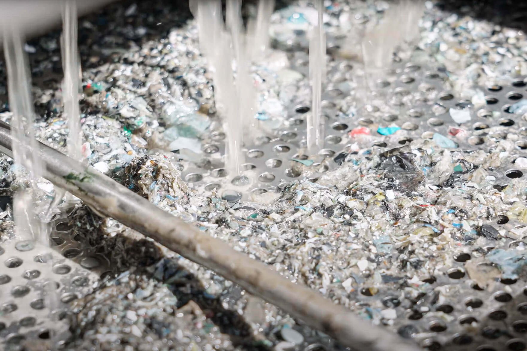 water dripping down on metal collection bin underneath puehler press