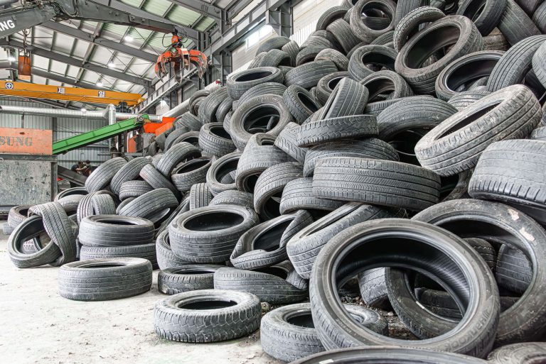 Stacked up care tyres before shredding