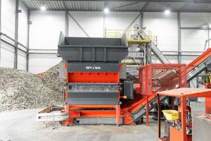 an orange WEIMA shredder W5.18 at a plastics recycler in the Netherlands