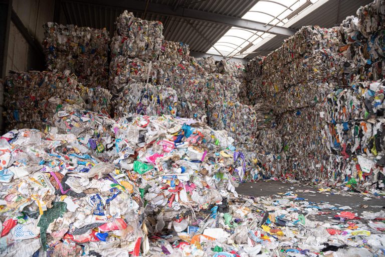 Bales of post-consumer plastics before shredding with a WEIMA shredder