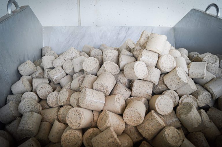 a box of cut-off briquettes