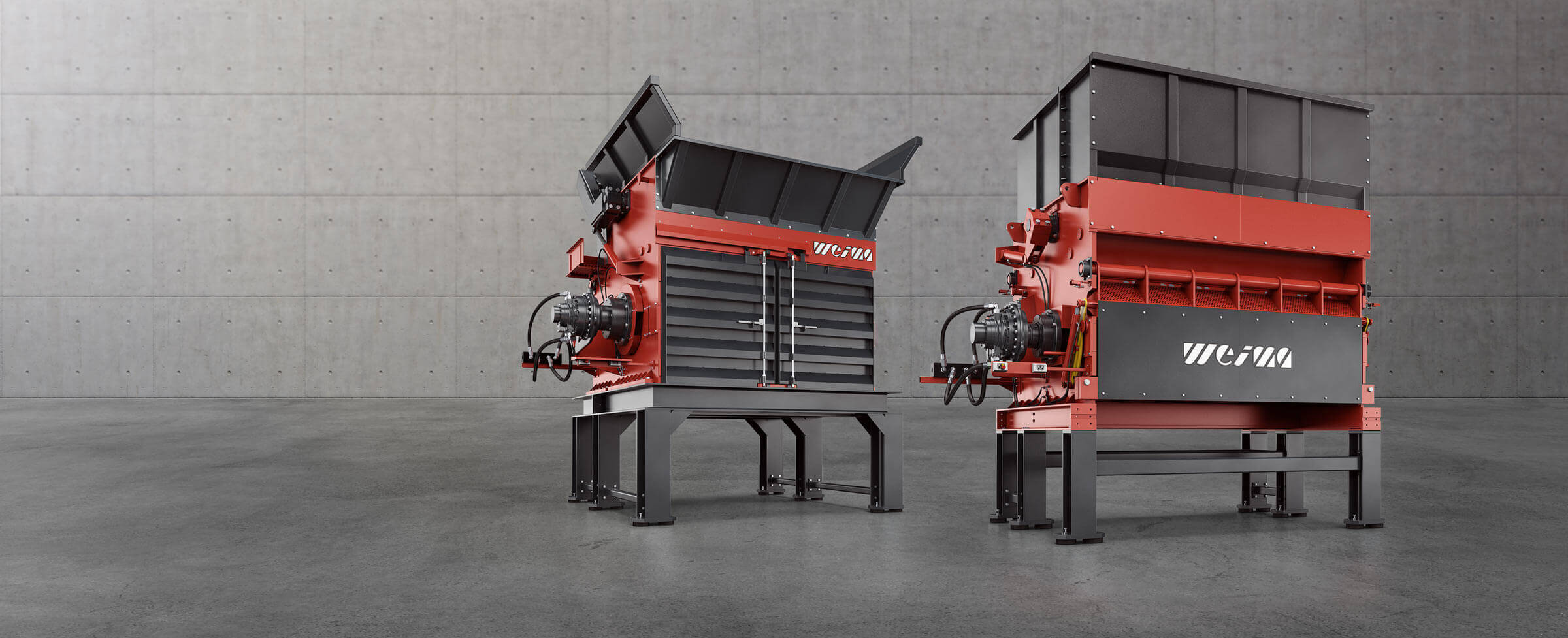 HÄGGLUNDS Bosch Rexroth Hydraulikantriebe an zwei WEIMA Abfallzerkleinerern, die auf einem Betonboden stehen