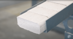 WEIMA TH 1200 briquette press compacts wood shavings into solid briquettes