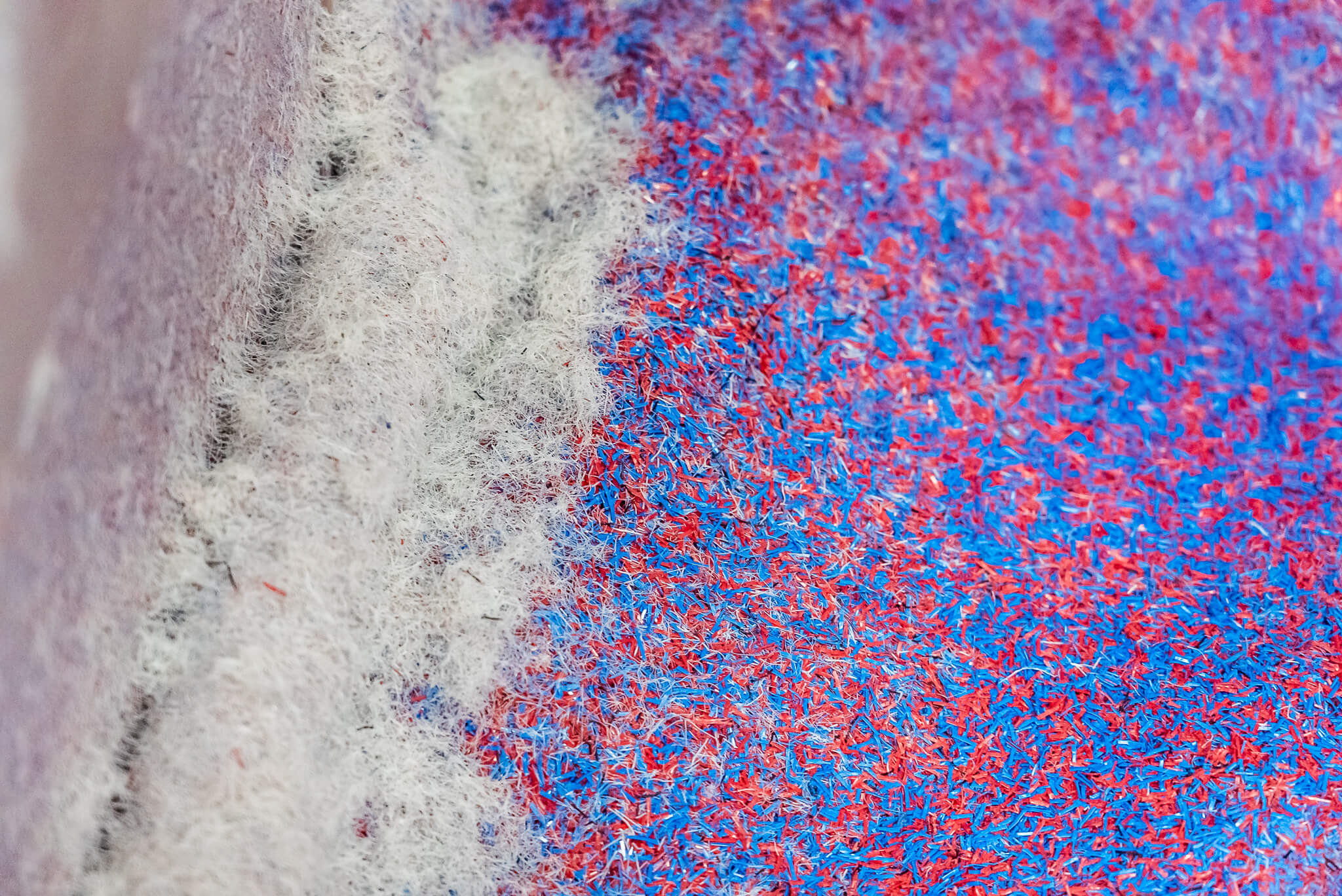 Shredded plastic fibers into granulate
