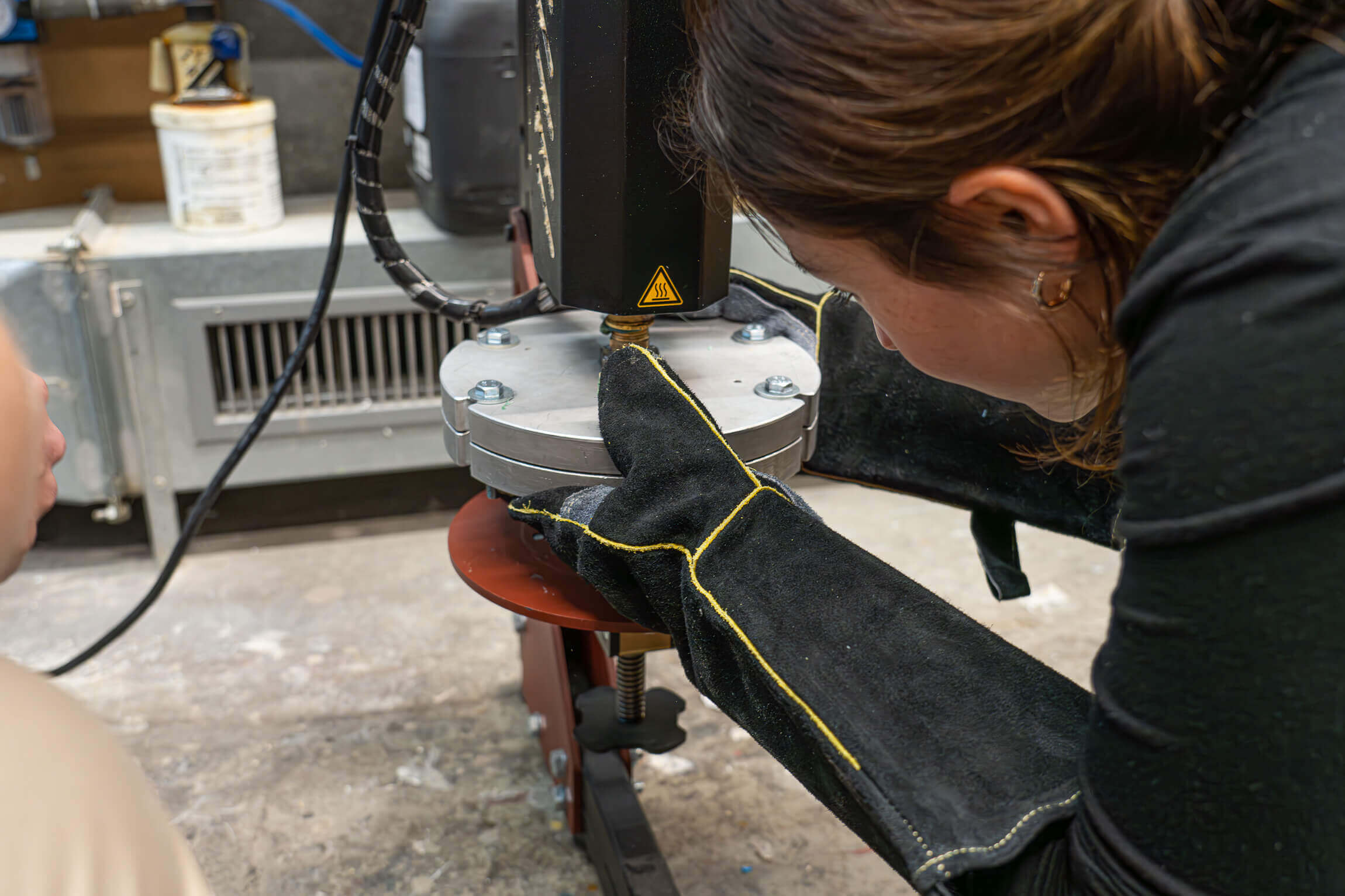woman with glove installing the injection mould