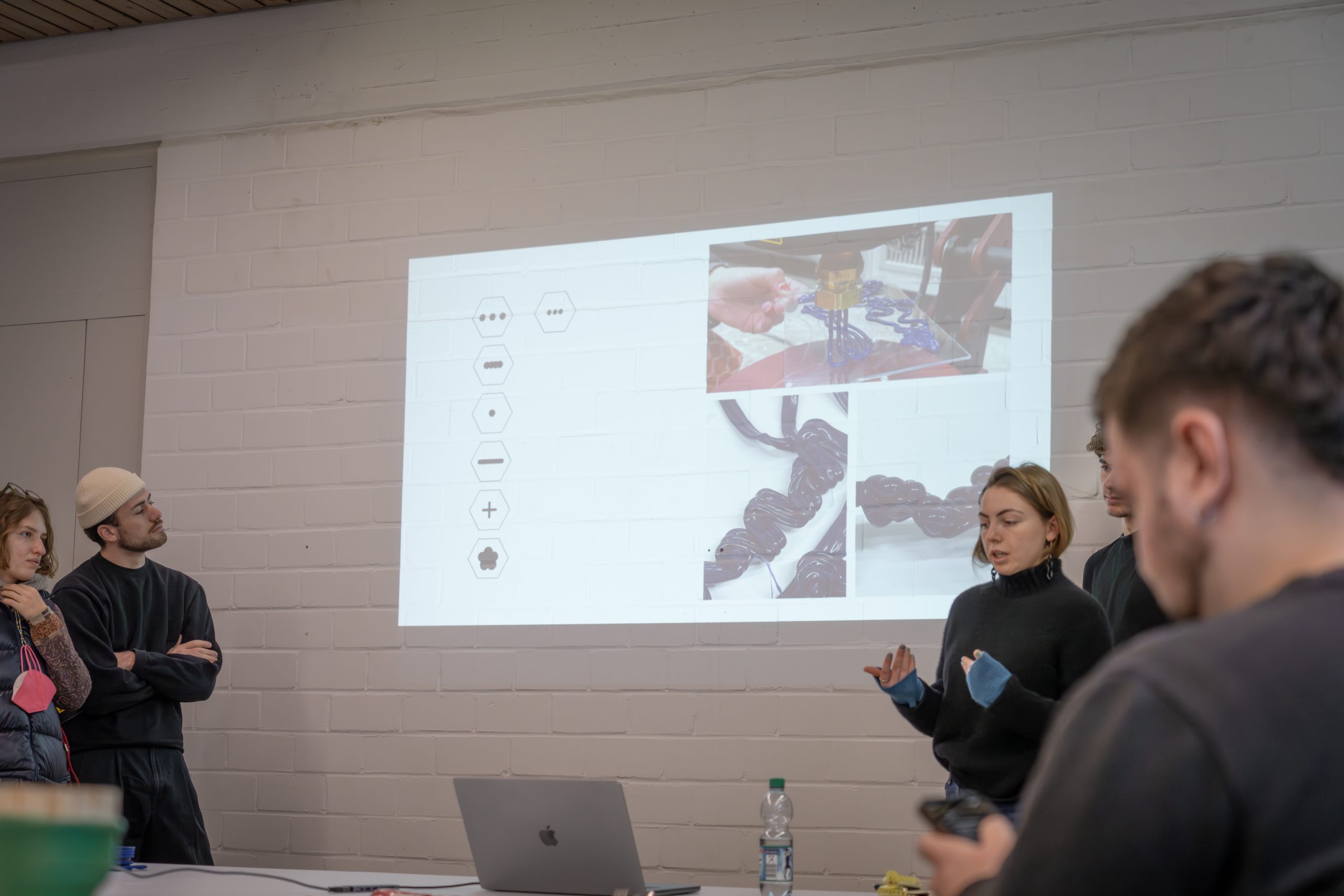 Workshop final results presentation with a student in front of her power point presentation