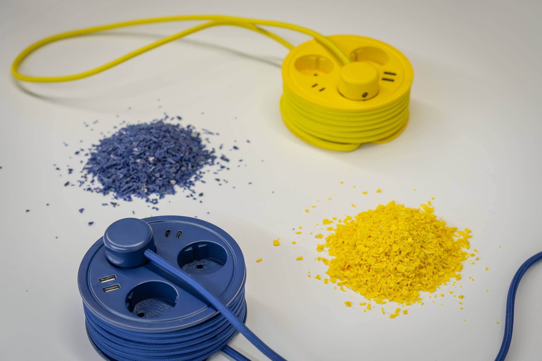 Colorful power sockets with cables made from recycled plastics