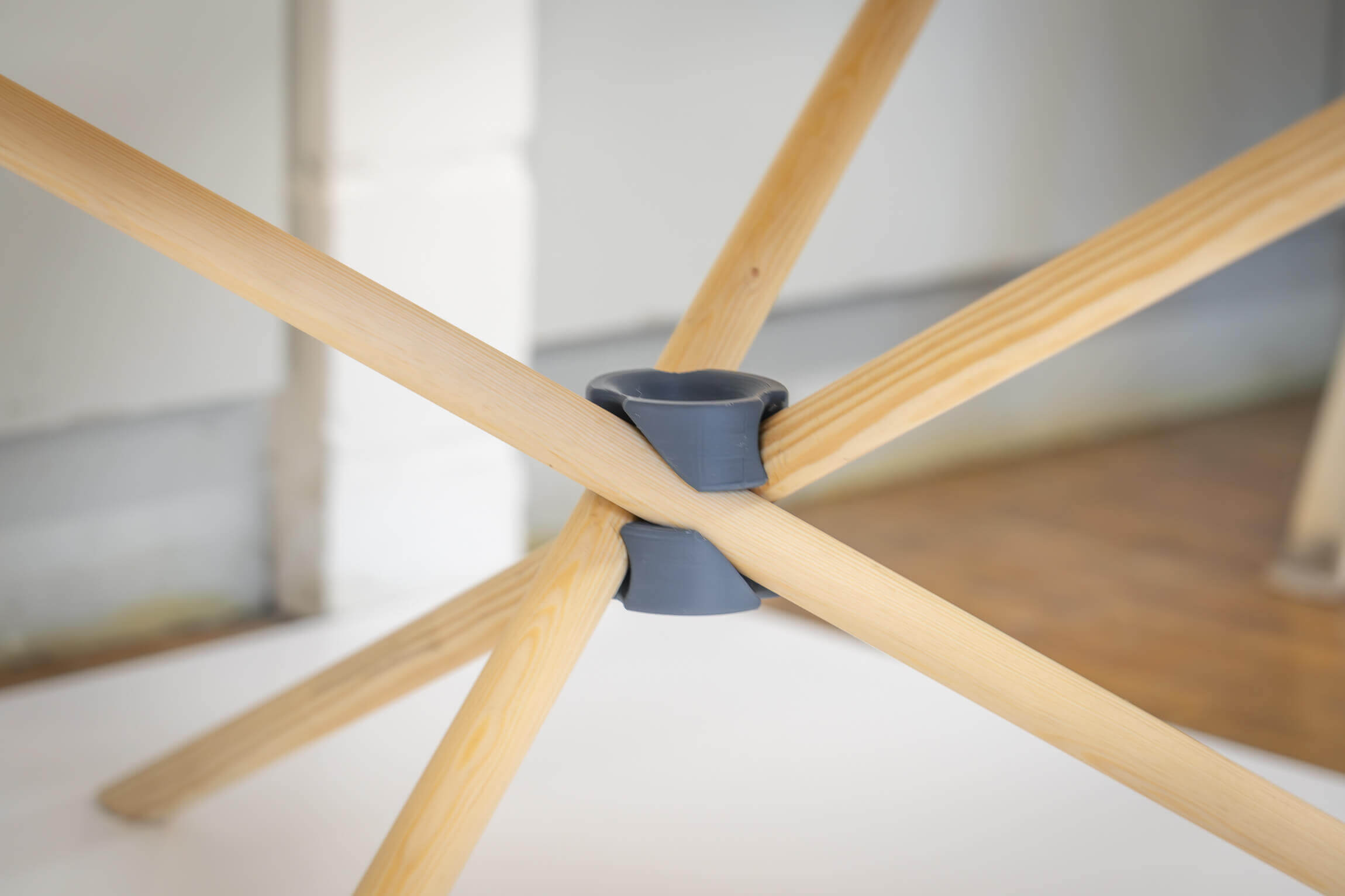 Plastic wood connection without screws connecting three wooden sticks