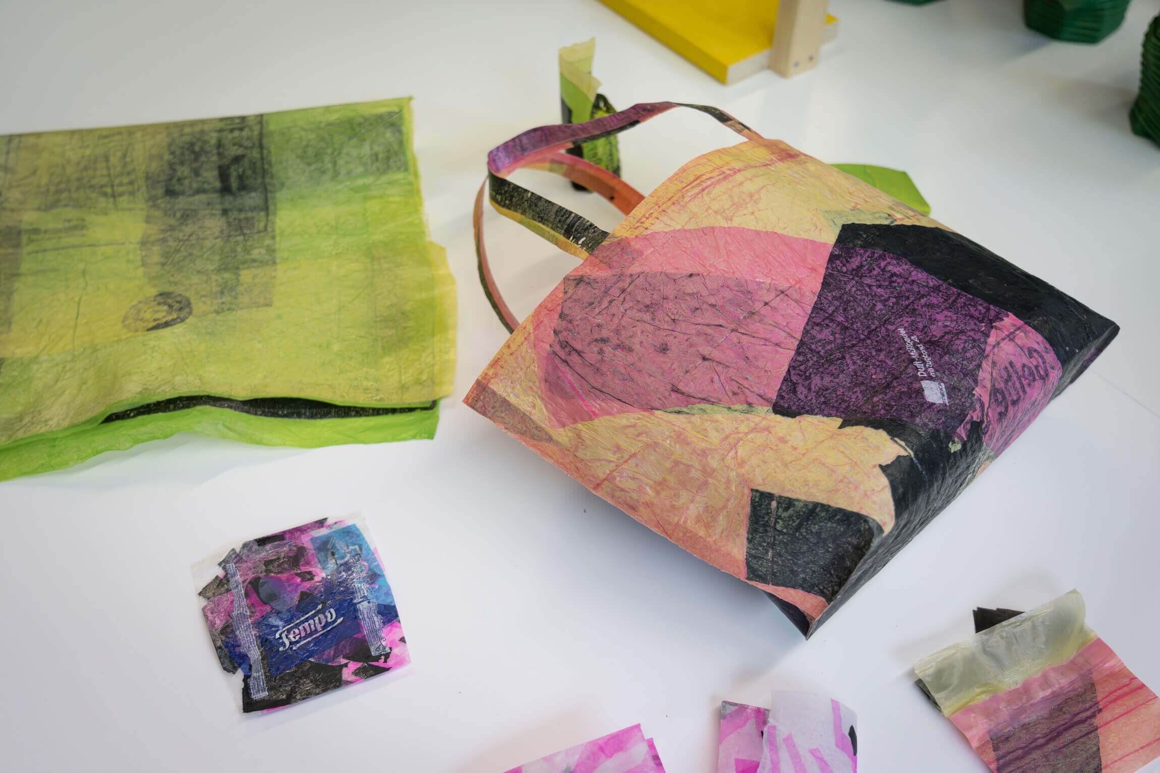 Recycled plastic bags on a white table