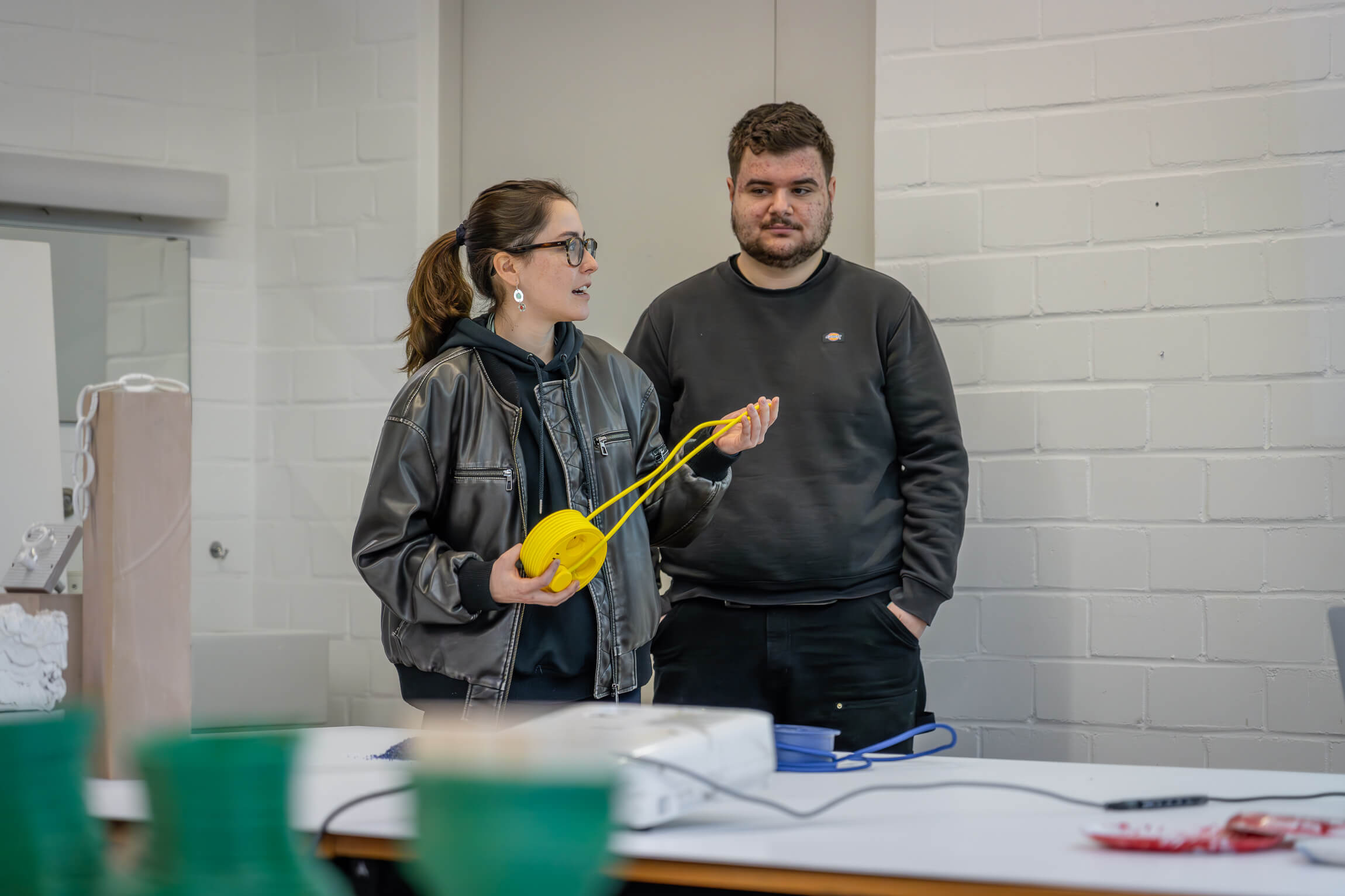 students presenting their product design results in front of the class