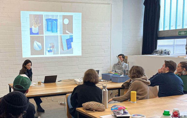 inside seminar room a fine art school in stuttgart with students listening to a lecture