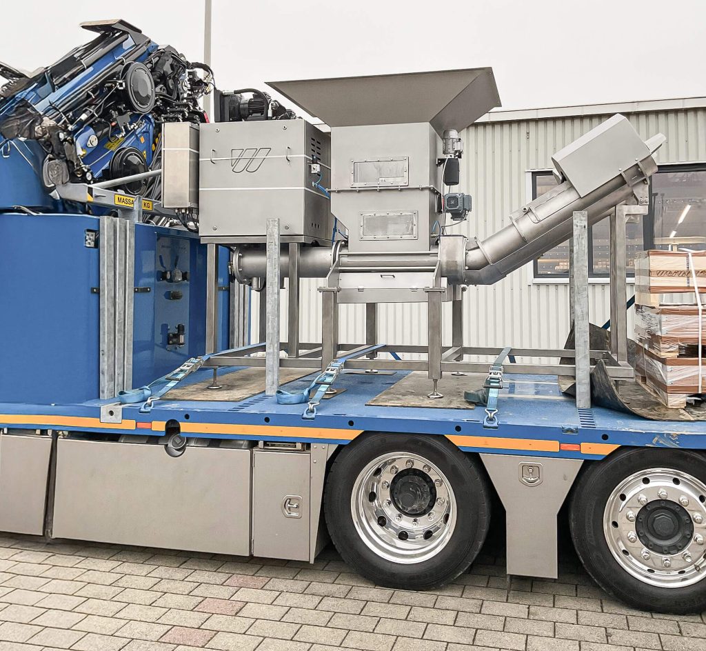 WEIMA C.200 drainage press after overhaul, ready for shipment on a truck