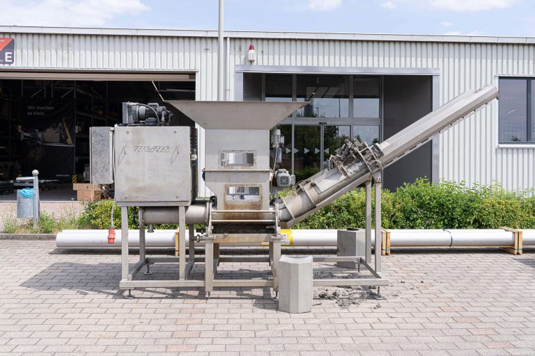 C.200 Duo press before overhaul in front of a WEIMA building