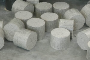 A stack of white cardboard briquettes