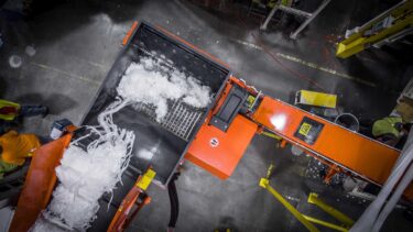 View of the cutting room of a single-axis shredder during film shredding