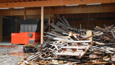 Wood waste beside WEIMA shredder