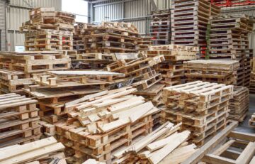 Stacks with old wooden pallets