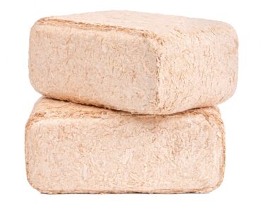 two wood briquettes stacked together