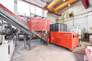 Two-stage pallet handling system