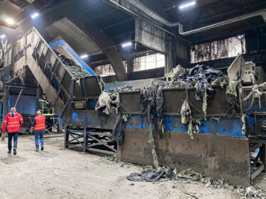 Agricultural film on the shredder conveyor belt