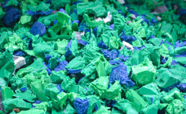 Plastic flakes form HDPE pipe shredding