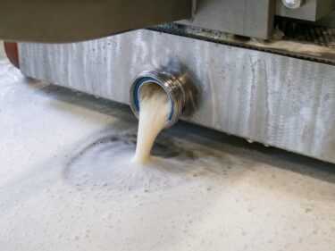 The pressed out beer can the pumped out of the drain pan