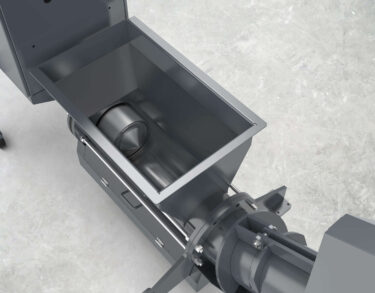 View into the hopper. This shows the press plunger in the press channel and the absence of a screw conveyor.