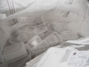 A gaylord of used take-away containers awaits shredding.