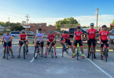 Velocity Cycling team members on their bicycles