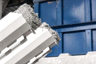 Duo material discharge of dried plastic objects