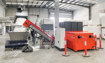 orange weima shredder next to a blue erema extrusion system for film recycling