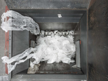 View into the cutting room of a WEIMA plastic shredder that shreds transparent LDPE film with a rotor