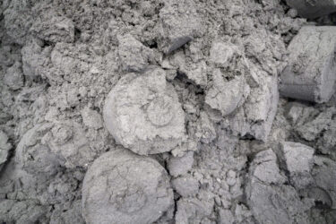 A mountain full of dry grinding sludge, partly in compressed form