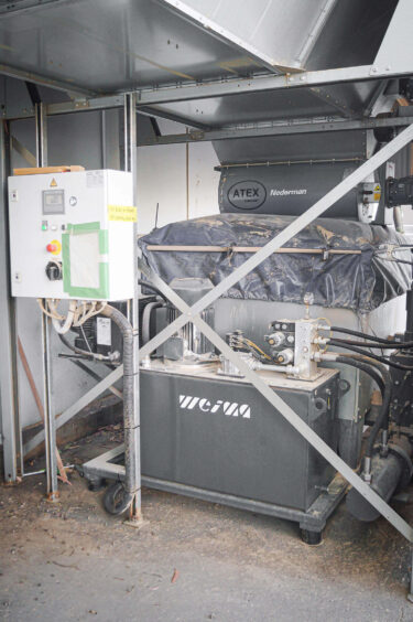 a briquette press from WEIMA outdoors with material supplied through air extraction