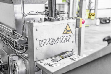 Close up shot of drainage press with WEIMA logo