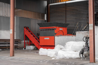 The WEIMA s7.20 single-shaft shredder in a hall