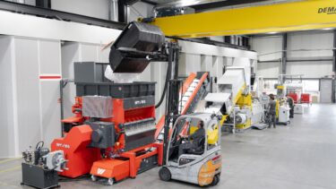 Orange WEIMA Plastic Shredder and NGR extrusion machine for plastic recycling in a production hall