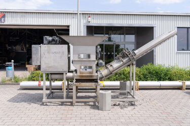 C.200 Duo press before overhaul in front of a WEIMA building